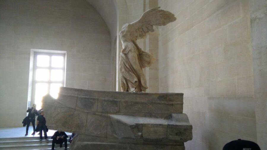 Paris: Guided Louvre Museum Tour with Optional Entry Ticket - Meet your guide by Louis XIV with a yellow My Super Tour sign