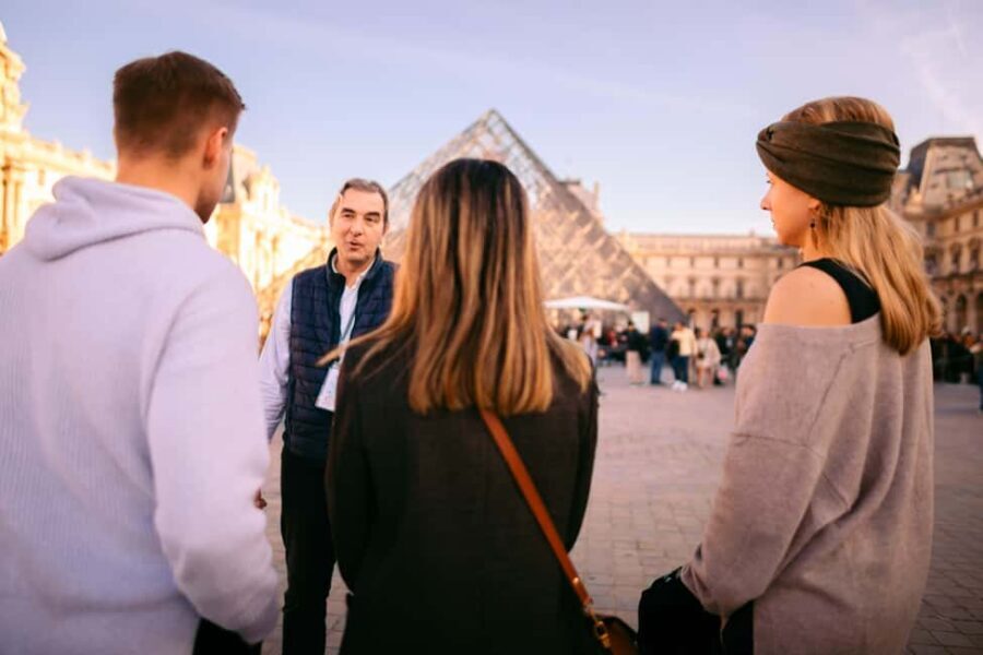 Paris Louvre Exclusive Semi Private Guided Tour Max 6 People - Passing the Louvre Pyramid: the moment that sets expectations