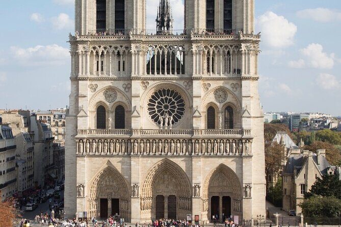 Private Tour with Tickets to the Louvre Museum & Crepes - Back toward the Louvre: city hall, a surviving tower, and the Palais-Royal galleries